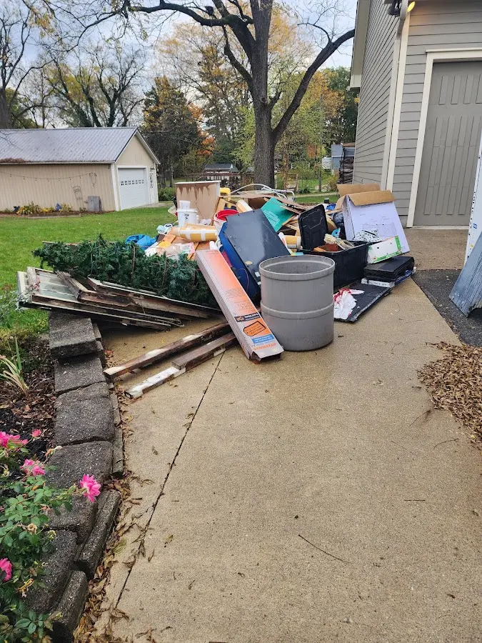 Dumpster being loaded with debris for 30 Yard Dumpster Rental in Sherborn